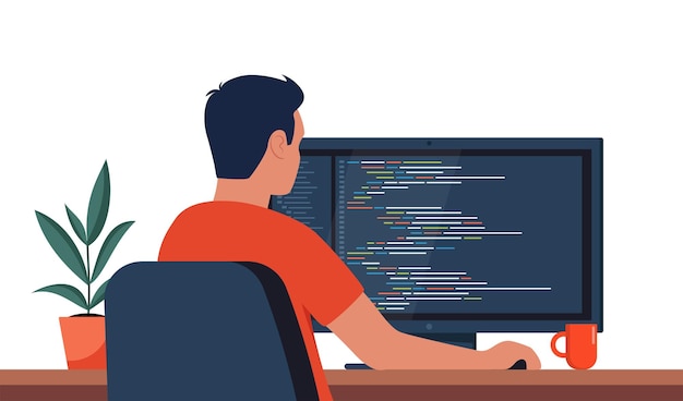 young man writing code on a desktop computer software developer at work programming